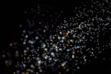 siyah arka plan üzerinde renkli bokeh