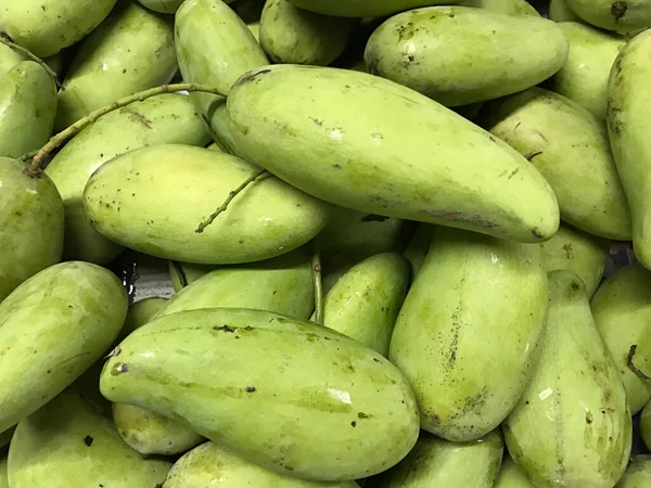 Green mango in the market background