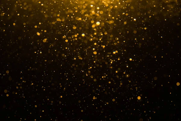 Siyah arkaplan ile soyut altın bokeh