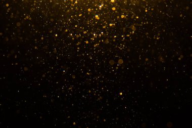 Siyah arkaplan ile soyut altın bokeh