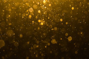 Siyah arkaplan ile soyut altın bokeh