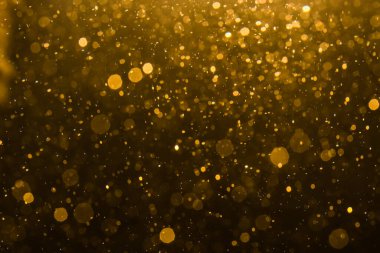 Siyah arkaplan ile soyut altın bokeh