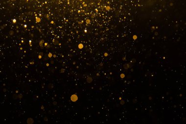 Siyah arkaplan ile soyut altın bokeh