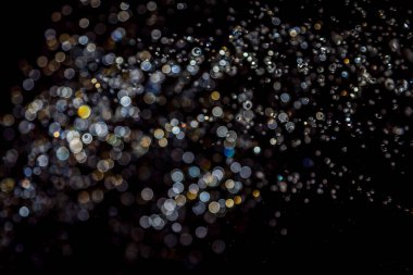 siyah arka plan üzerinde renkli bokeh