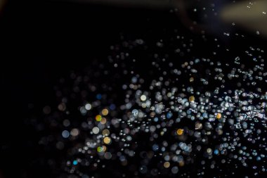 siyah arka plan üzerinde renkli bokeh