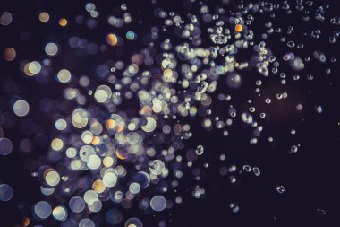 Defocus bokeh simli altın antika ışıklar koyu arkaplan