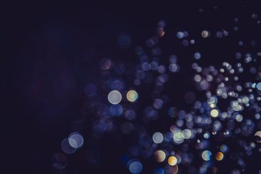 Defocus bokeh simli altın antika ışıklar koyu arkaplan