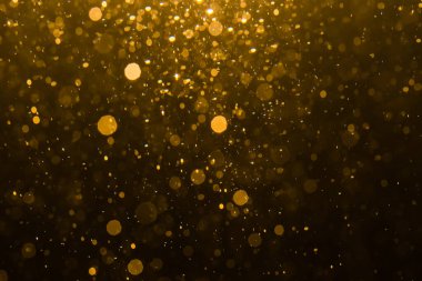 Siyah arkaplan ile soyut altın bokeh