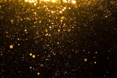 Siyah arkaplan ile soyut altın bokeh