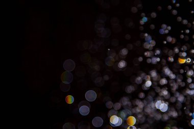 Siyah arkaplanda ışık bokeh