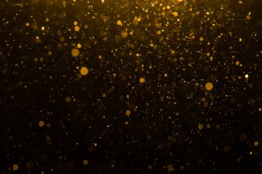 Siyah arkaplan ile soyut altın bokeh