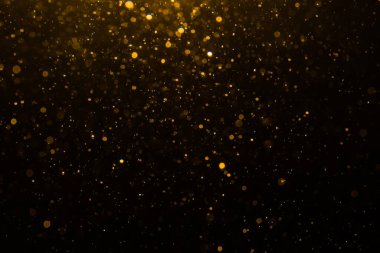 Siyah arkaplan ile soyut altın bokeh