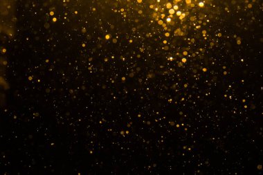 Siyah arkaplan ile soyut altın bokeh