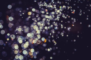 Defocus bokeh simli altın antika ışıklar koyu arkaplan