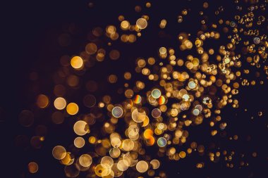 Defocus bokeh simli altın antika ışıklar koyu arkaplan