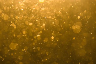 Siyah arkaplan ile soyut altın bokeh