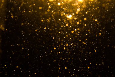Siyah arkaplan ile soyut altın bokeh