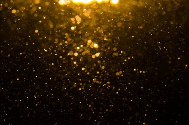 Siyah arkaplan ile soyut altın bokeh