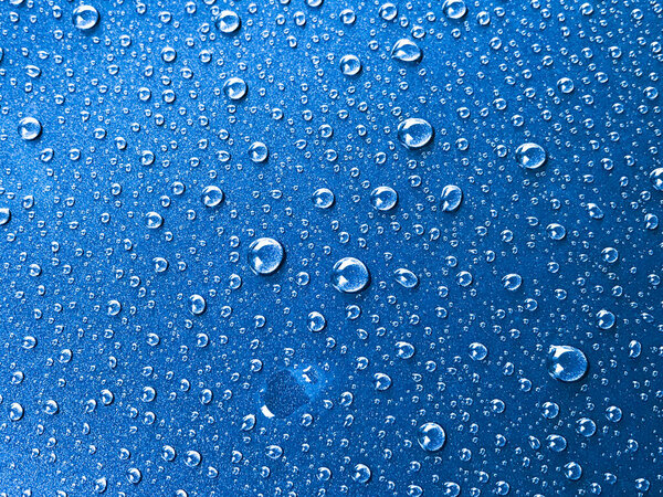 Water drop on blue background