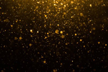 Siyah arkaplan ile soyut altın bokeh