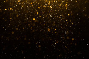 Siyah arkaplan ile soyut altın bokeh