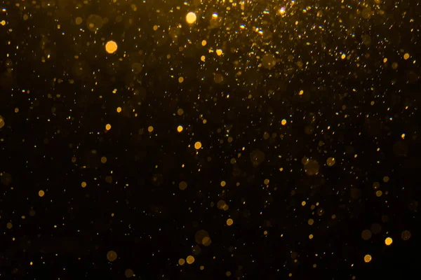 Siyah arkaplan ile soyut altın bokeh