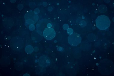 Noel arkaplanı için soyut mavi ışık bulanık bokeh halkaları