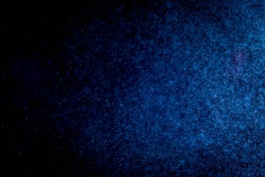 Siyah arkaplanda mavi bokeh