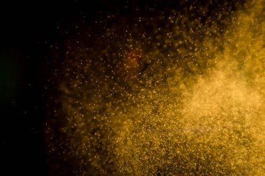 Siyah arkaplandaki altın bokeh 'i kaldır