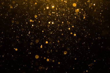 Siyah arkaplan ile soyut altın bokeh