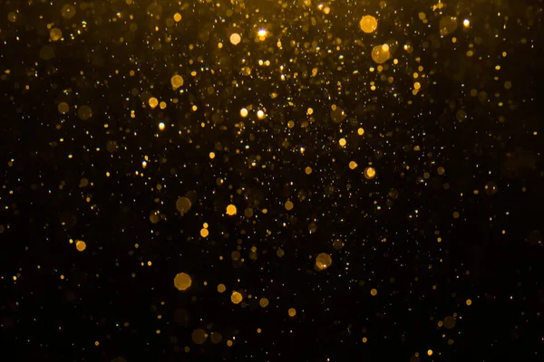 Siyah arkaplan ile soyut altın bokeh
