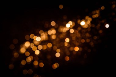 Siyah arkaplanda altın soyut bokeh