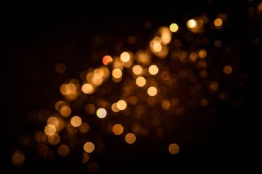 Siyah arkaplanda altın soyut bokeh