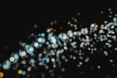 siyah arka plan üzerinde renkli bokeh