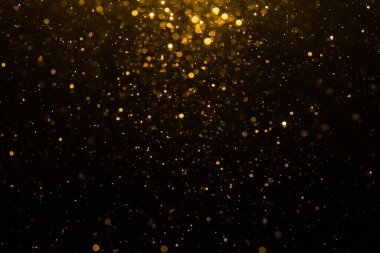 Siyah arkaplan ile soyut altın bokeh