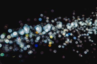 siyah arka plan üzerinde renkli bokeh