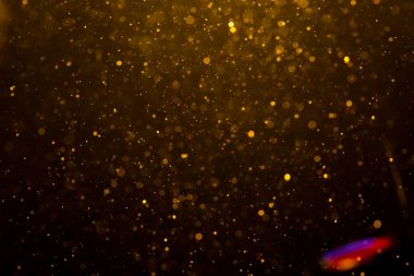 Siyah arkaplan ile soyut altın bokeh