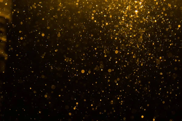Siyah arkaplan ile soyut altın bokeh