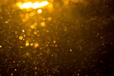 Siyah arkaplan ile soyut altın bokeh