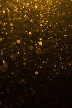 Siyah arkaplan ile soyut altın bokeh