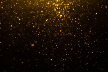 Siyah arkaplan ile soyut altın bokeh