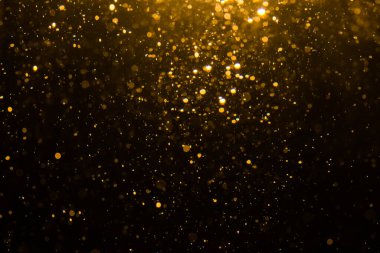 Siyah arkaplan ile soyut altın bokeh