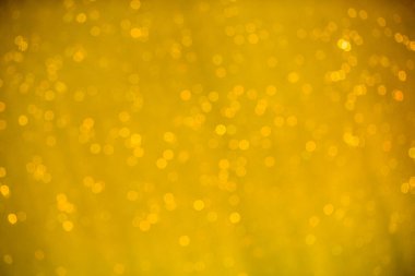 Su arka planında soyut altın ve beyaz bokeh ve kabarcıklar