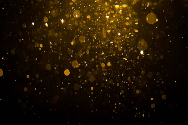 Siyah arkaplan ile soyut altın bokeh