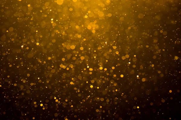 Siyah arkaplan ile soyut altın bokeh