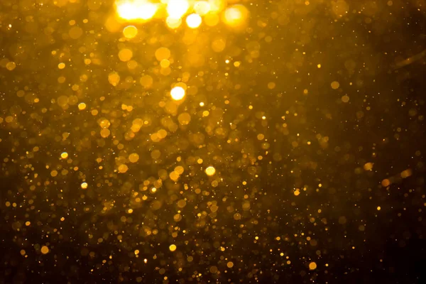 Siyah arkaplan ile soyut altın bokeh