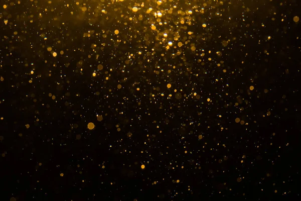 Siyah arkaplan ile soyut altın bokeh