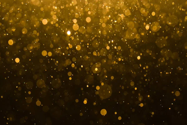 Siyah arkaplan ile soyut altın bokeh