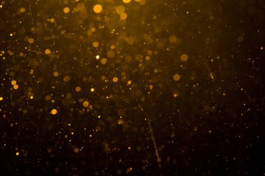 Siyah arkaplan ile soyut altın bokeh