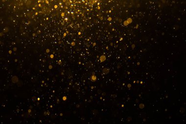 Siyah arkaplan ile soyut altın bokeh